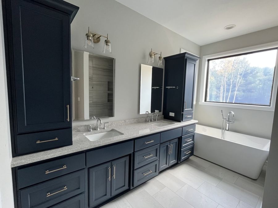 Primary bath with a navy vanity