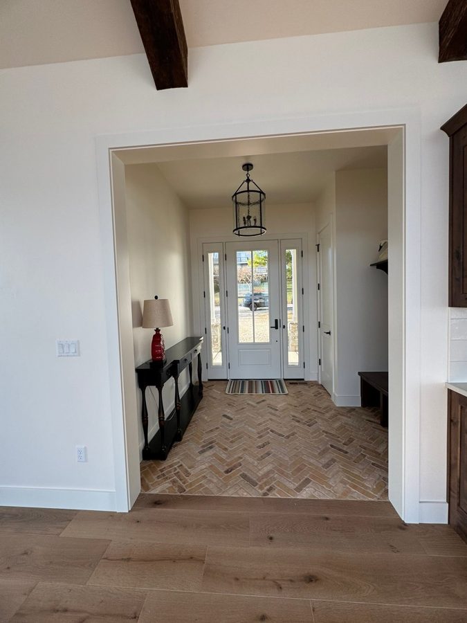 Foyer with a herringbone floor