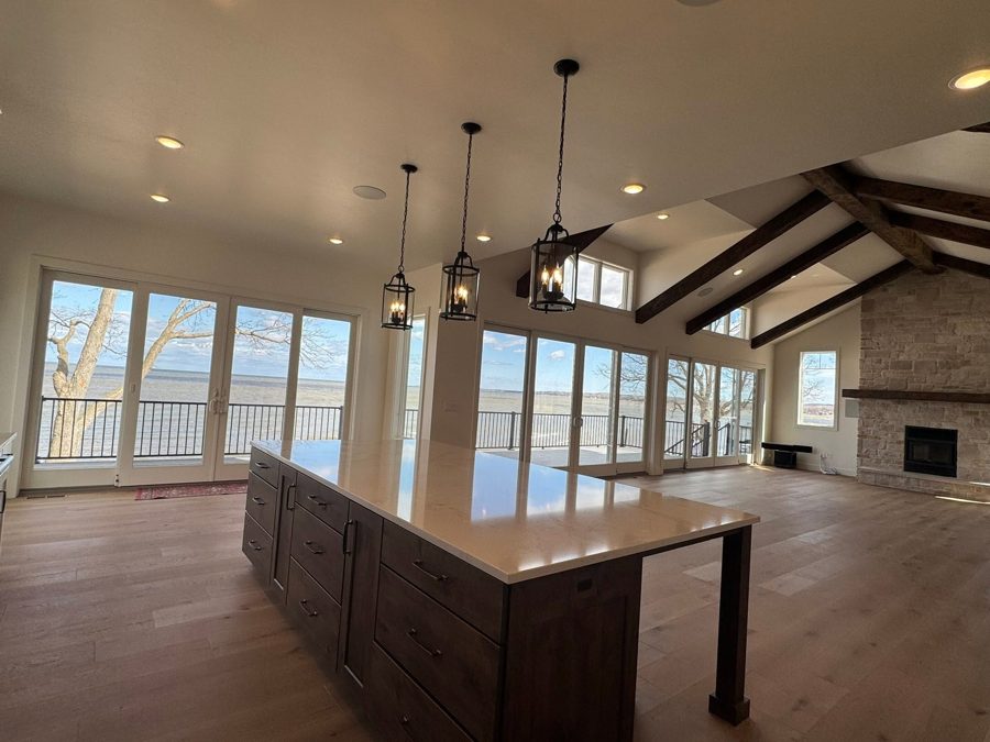 Great room and kitchen island facing the water