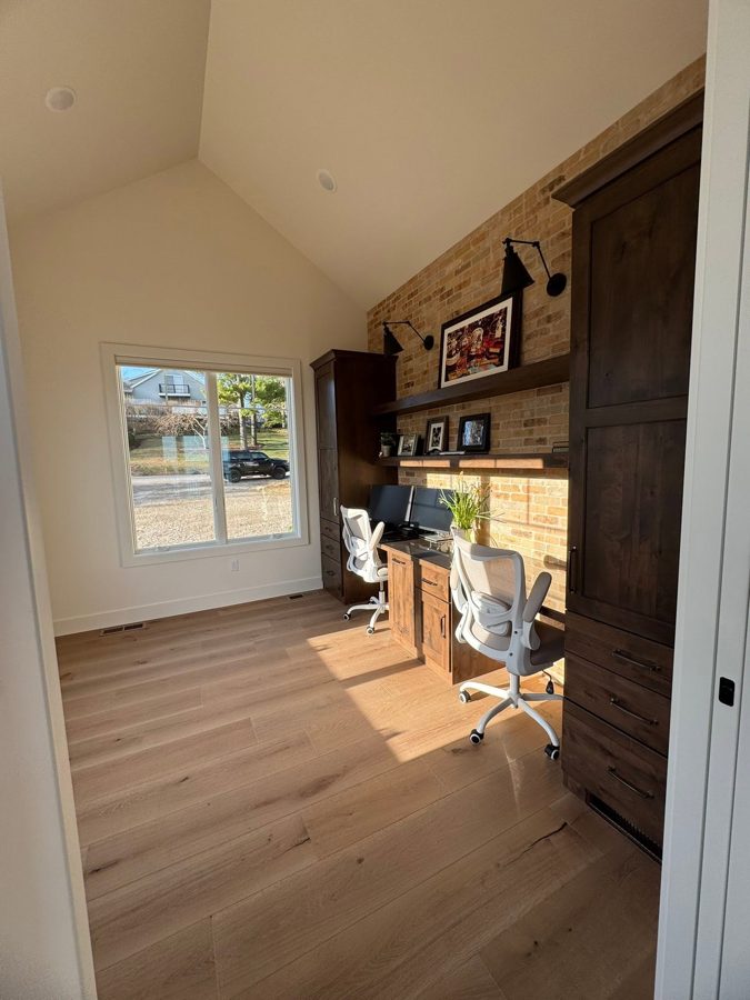 Office with a built-in brick accent wall