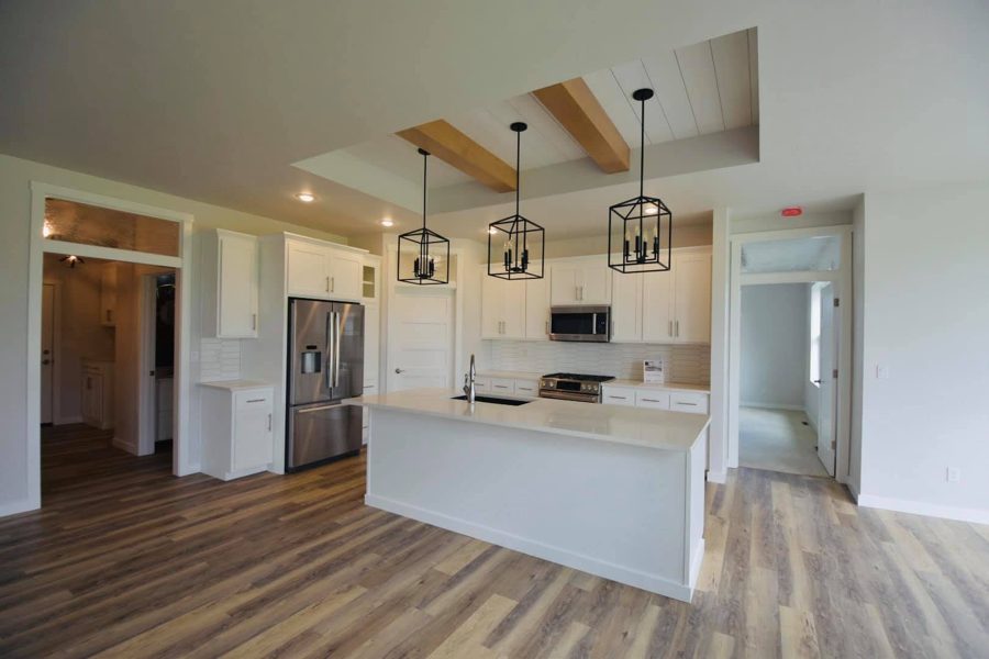 Kitchen with an island and beamed ceiling